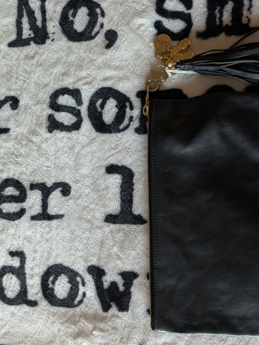 Black Leather Tassel Wristlet Clutch with Gold Accents